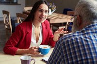 professional woman and man having coffee