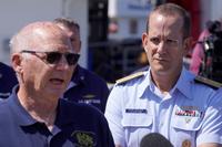U.S. Navy civilian contractor speaks at a press conference. 