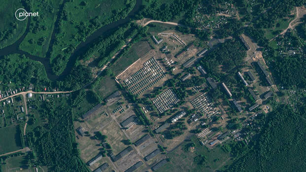 This satellite image shows apparent recent construction of tents at a former military base outside the Belarusian town of Osipovichi. 