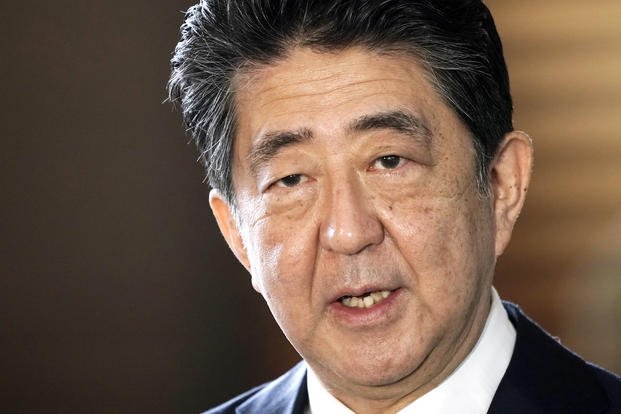 Japan's Prime Minister Shinzo Abe speaks to the media