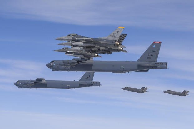U.S. B-52H bombers, center, and F-16 fighter jets and South Korean Air Force F-35A fighter jets