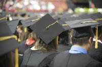 College graduates at graduation ceremony.