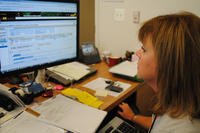 Professional business woman using a computer.