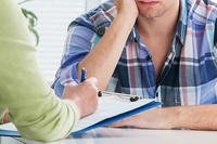 Counseling at a desk.