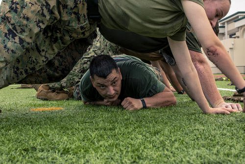 Marine conducts low crawls.