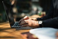 Man typing on laptop