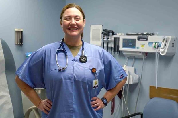 Maj. Marcie Hart, 15th Wing Medical Group family nurse practitioner, provides patient care at Joint Base Pearl Harbor-Hickam, Hawaii. (U.S. Air Force/Airman 1st Class Makensie Cooper)