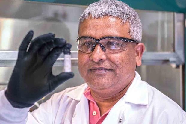 Dr. Anit Giri, a physicist with the U.S. Army Research Laboratory, observes a sample of a unique aluminum nanomaterial powder that reacts with water to produce hydrogen and oxygen. (Army Research Laboratory)