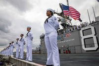 Sailors aboard amphibious assault ship USS Makin Island (LHD 8) man the rails as the ship returns to Naval Base San Diego