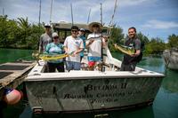 Navy members show off their catch after an MWR fishing trip