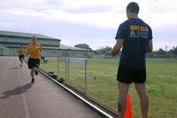 Airmen take part in a 1.5-mile run as part of the Navy SEAL physical screening test.