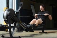 Airman rows during a physical training test.