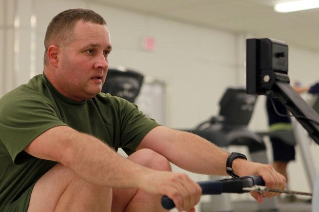 Gunnery Sgt. Chad Trebil, the 2nd Marine Division (Forward) intelligence section operations chief, uses a rowing machine aboard Camp Leatherneck, Afghanistan, Aug. 18, 2011. (Cpl. Tommy Bellegarde/U.S. Marine Corps photo) A Marine works out on a rowing machine.