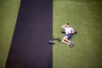 An airman stretches.