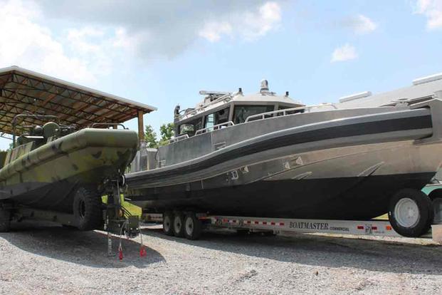 A Riverine Patrol Boat and a Coastal Fast Response Boat at the Silver Ships boatyard