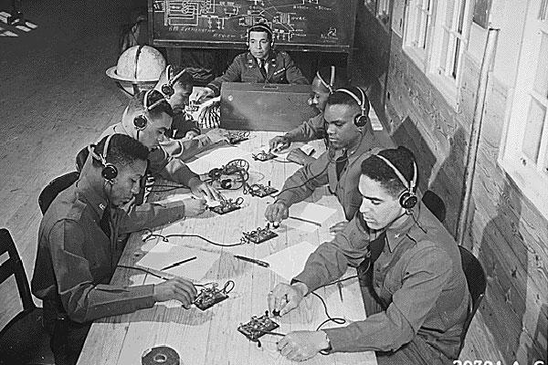 Capt. Roy F. Morse teaches the 99th Pursuit Squadron how to send and receive code. (National Archives)