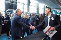 Veterans network at a job fair. 