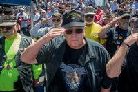 U.S. Marine Corps veterans salute during the 5th Marines Vietnam War Memorial unveiling ceremony in the Camp San Mateo Memorial Garden at Marine Corps Base Camp Pendleton, California. 