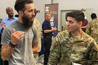 U.S. Army Sgt. Euleam Aviles, a wheeled vehicle mechanic assigned to 3rd Division Sustainment Brigade, 3rd Infantry Division, attends a national job fair at Fort Stewart, Georgia.